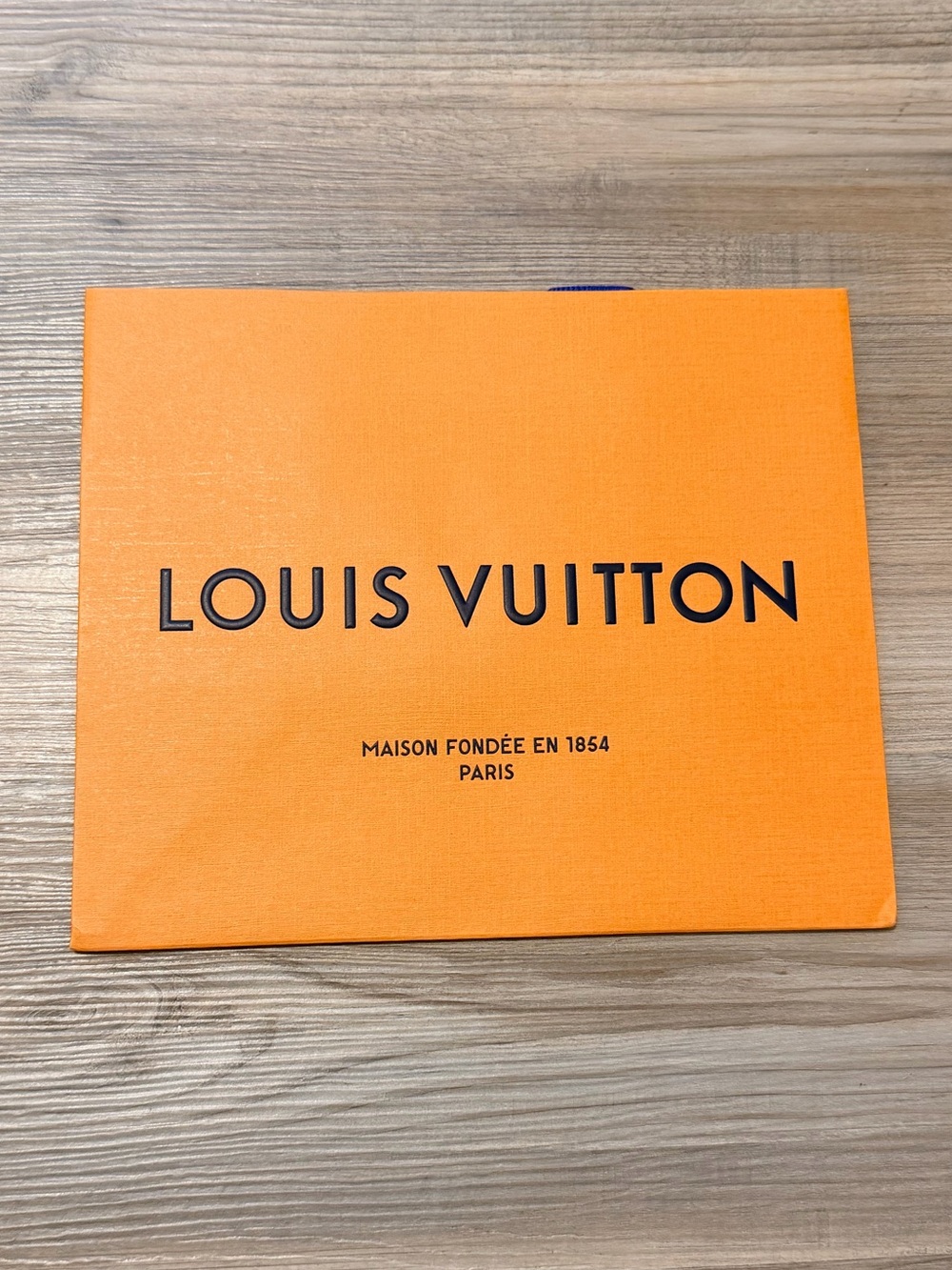 Louis Vuitton gift bag 
Orange with Black Logo
